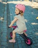 Laufrad Cabo Runner rosa mit Kind